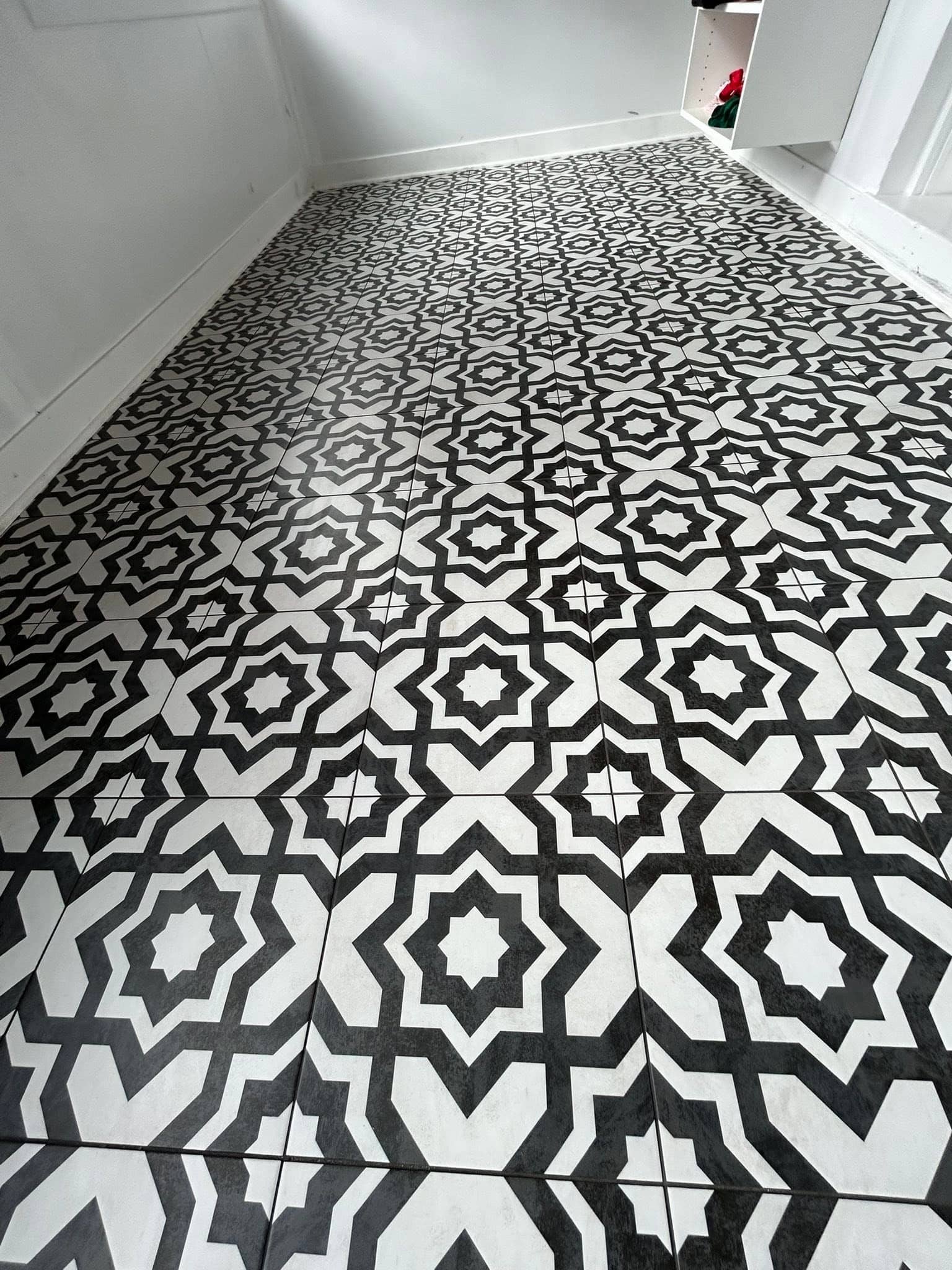 Black and white geometric patterned tile floor